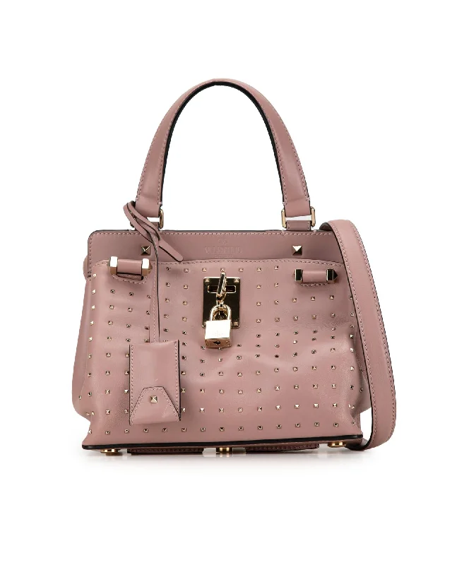 Studded Leather Satchel with Flip-Lock Closure and Multiple Pockets